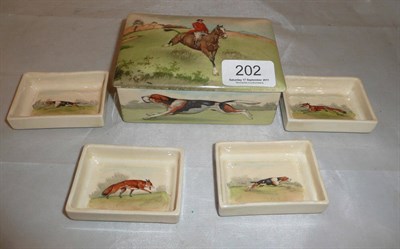 Lot 202 - A Royal Doulton hunting scene box and cover containing four rectangular dishes