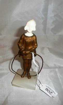 Lot 206 - An Art Deco bronze and ivory figure of a Dutch Girl, possibly by Bertrand, holding a hoop, on...