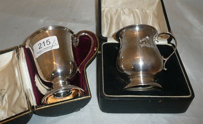 Lot 215 - Two cased silver mugs, 6oz