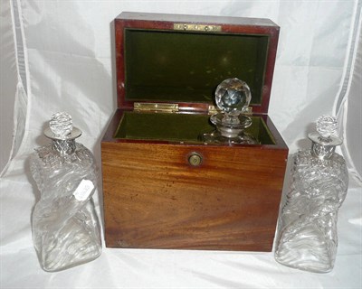 Lot 243 - A Victorian mahogany decanter box containing one decanter, a pair of 'twisted' square decanters...