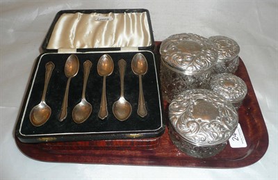 Lot 244 - Five silver-topped jars, a set of six teaspoons and a pair of tongs, six teaspoons and six...