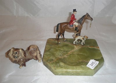 Lot 245 - Cold painted spelter figure of a huntsman on onyx base and a spelter figure of a dog