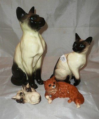 Lot 263 - Two Beswick cats, Doulton cat and a fireside cat ornament