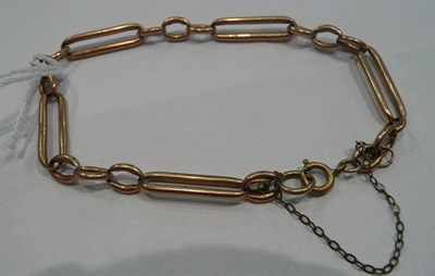 Lot 282 - A trombone link rose gold bracelet