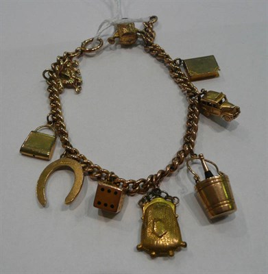 Lot 283 - A 9ct gold charm bracelet with gold and other charms