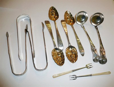 Lot 1 - Three silver sugar tongs, set of four 'berry' teaspoons (adapted), pair of cream ladles, pair...