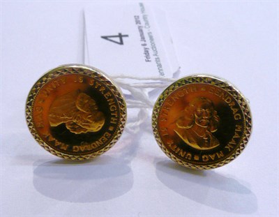 Lot 4 - A pair of yellow metal cufflinks, each mounted with a South African One Rand 22ct gold coin