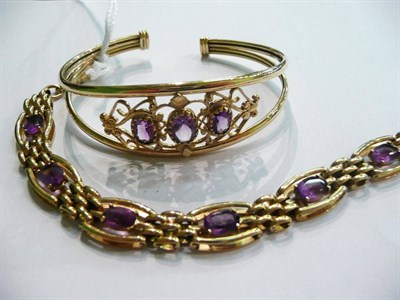 Lot 14 - A 9ct gold bracelet set and an amethyst and gold bracelet