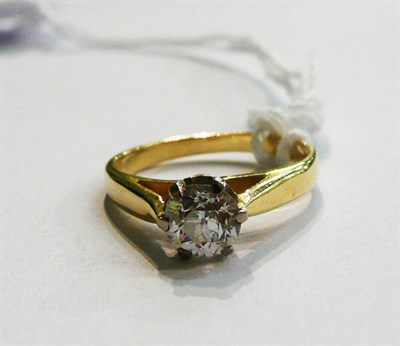 Lot 25 - A diamond solitaire ring, the old cut diamond within a white six claw setting, to a yellow...