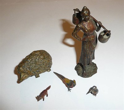 Lot 30 - An Austrian bronze small figure of a milkmaid, an Austrian bronze small hedgehog (3cm) stamped...