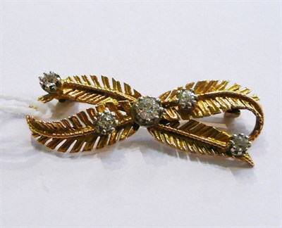 Lot 32 - A diamond and gold fern bow brooch