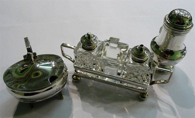 Lot 35 - A silver pepperette, silver topped condiments with plated stand and a silver salt