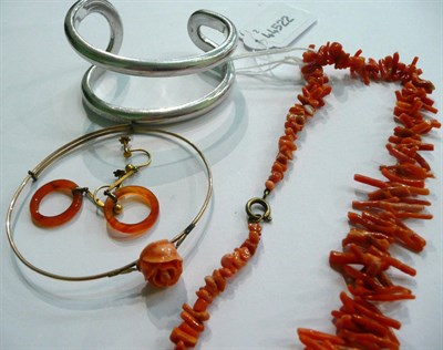 Lot 39 - A coral bangle, coral branch necklace, a pair of earrings and a bangle marked 'Armani'
