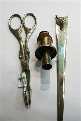 Lot 42 - A 9ct gold intaglio seal fob, a silver fox mask decorated paper knife, a wine pourer and a pair...