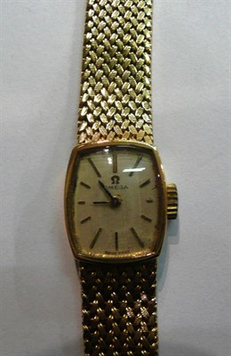 Lot 57 - A lady's Omega 9ct gold wristwatch on flexi-strap  #