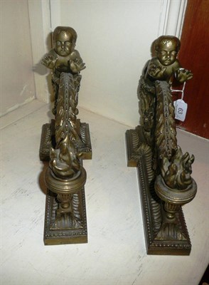 Lot 63 - A pair of gilt chenet