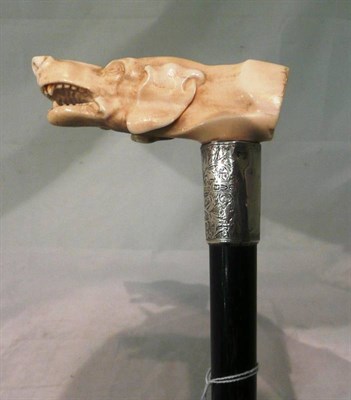 Lot 70 - An ivory handled walking stick modelled as a dog's head