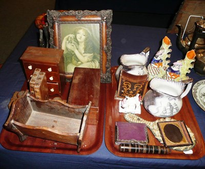 Lot 118 - Two trays including a pair of photograph frames, miniature chest, rush light, Staffordshire figures