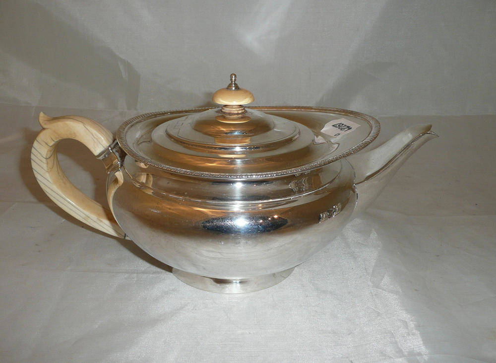 Lot 125 - Silver teapot with ivory handle, 23oz