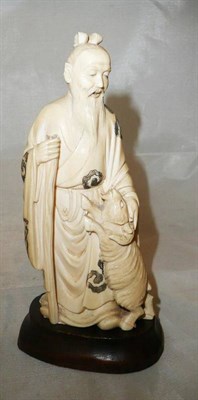 Lot 130 - Japanese one piece carved ivory figure - a sage and goat (a.f.)