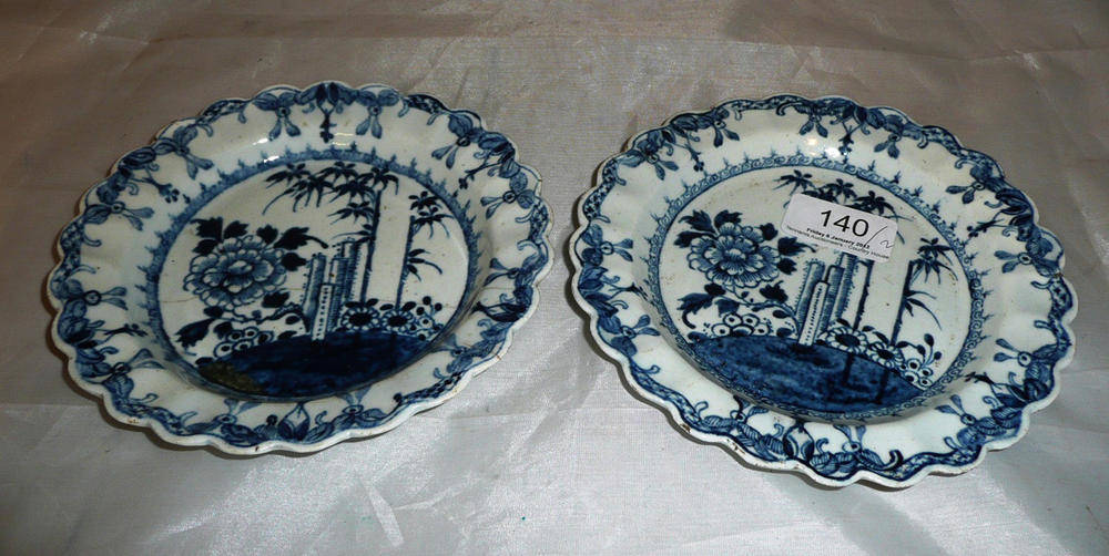Lot 140 - A pair of first period Worcester blue and white dessert plates