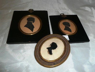 Lot 157 - Two 19th century framed silhouette portraits of a young gentleman dated 1817 & 1826 and an oval...