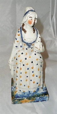Lot 188 - A Pratt type figure of a maid circa 1800, holding a bottle  #