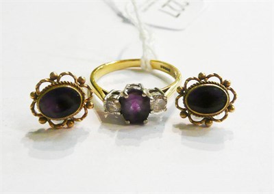 Lot 227 - An 18ct gold amethyst and diamond three stone ring and a pair of stud earrings