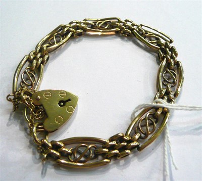 Lot 233 - A fancy link bracelet with heart padlock