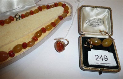 Lot 249 - An amber necklace, ring and earrings