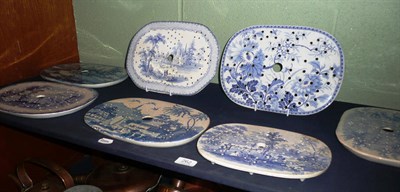 Lot 262 - Seven 19th century blue and white meat plate drainers *