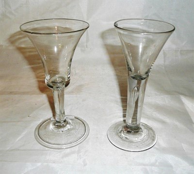 Lot 284 - Two 18th century wine glasses with large bell shaped bowls