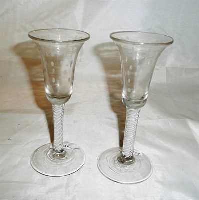 Lot 285 - A pair of Continental soda glasses with bell shaped engraved bowls and spiral twist stem