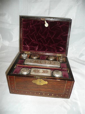 Lot 298 - 19th century rosewood and brass strung travelling box with silver plated and cut glass bottles *