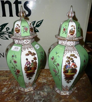 Lot 329 - A pair of Dresden porcelain vases painted with soldiers