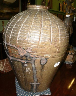 Lot 333 - A large Oriental stoneware jar with old iron staple repair