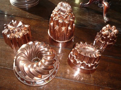 Lot 340 - A group of four Batterie de Cuisine copper jelly/sponge moulds, late 19th century, including...