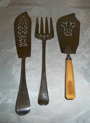 Lot 359 - A matched pair of Victorian fish servers and a Georgian fish slice with pierced fleur-de-lis blade