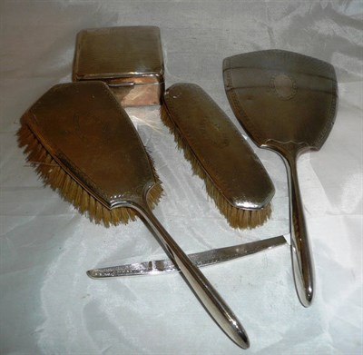 Lot 361 - A four piece silver backed dressing table set and a silver mounted cigarette case (5)  #