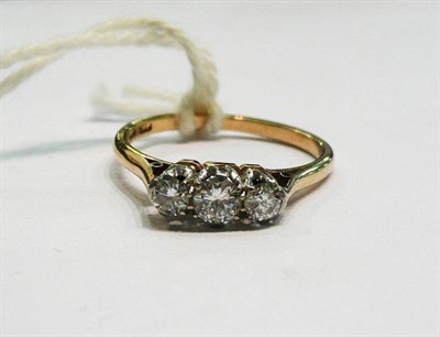 Lot 390 - A diamond three stone ring stamped '18c' and 'PT'