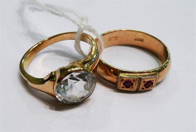 Lot 394 - A Russian band ring and a white stone ring