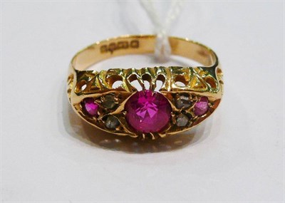 Lot 409 - An 18ct gold ruby and diamond cluster ring