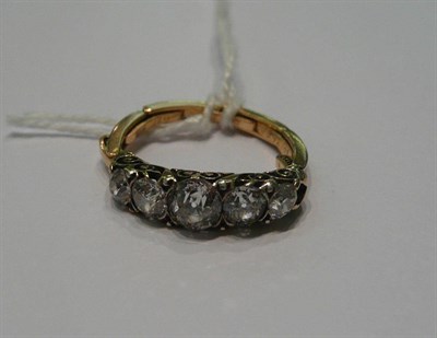 Lot 442 - A graduated old cut diamond five stone ring, on an expanding shank