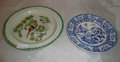 Lot 446 - Yorkshire pottery 'Peafowl' plate and a blue and white plate (2)