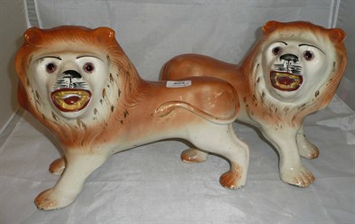 Lot 464 - A pair of 19th century Staffordshire lions