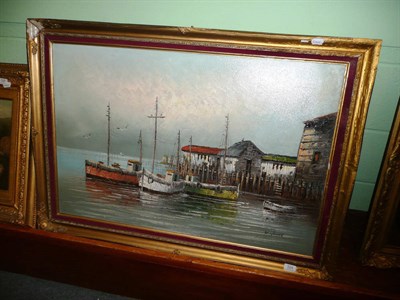 Lot 524 - W...Jones, fishing boats beside a wooden quay, signed, oil on canvas, laid down, 60cm by 91cm