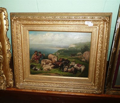 Lot 525 - Oil painting of children with sheep, goats and a Collie dog on a sunlit cliff, 19th century English