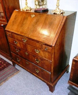 Lot 572 - A walnut bureau