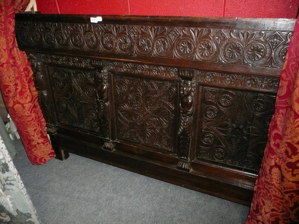 Lot 872 - A carved oak panels mounted as a headboard *