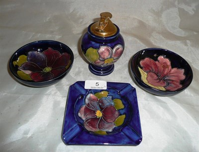 Lot 5 - Two Moorcroft dishes, ashtray and lighter (4)